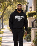 Isaiah outdoors wearing the DDA Warrior Mindset hoodie